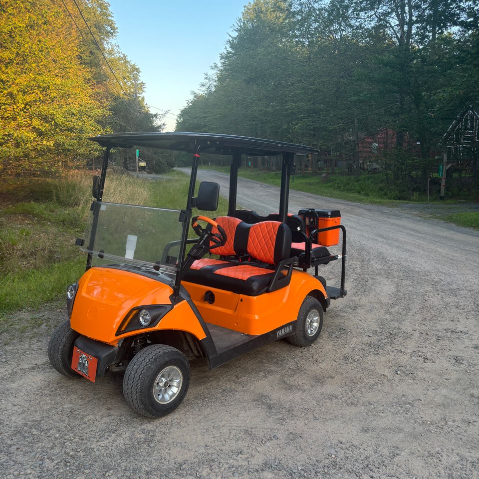 Orange golf cart rental from Mad Dog Golf Cart Rentals in Arrowhead Lake PA