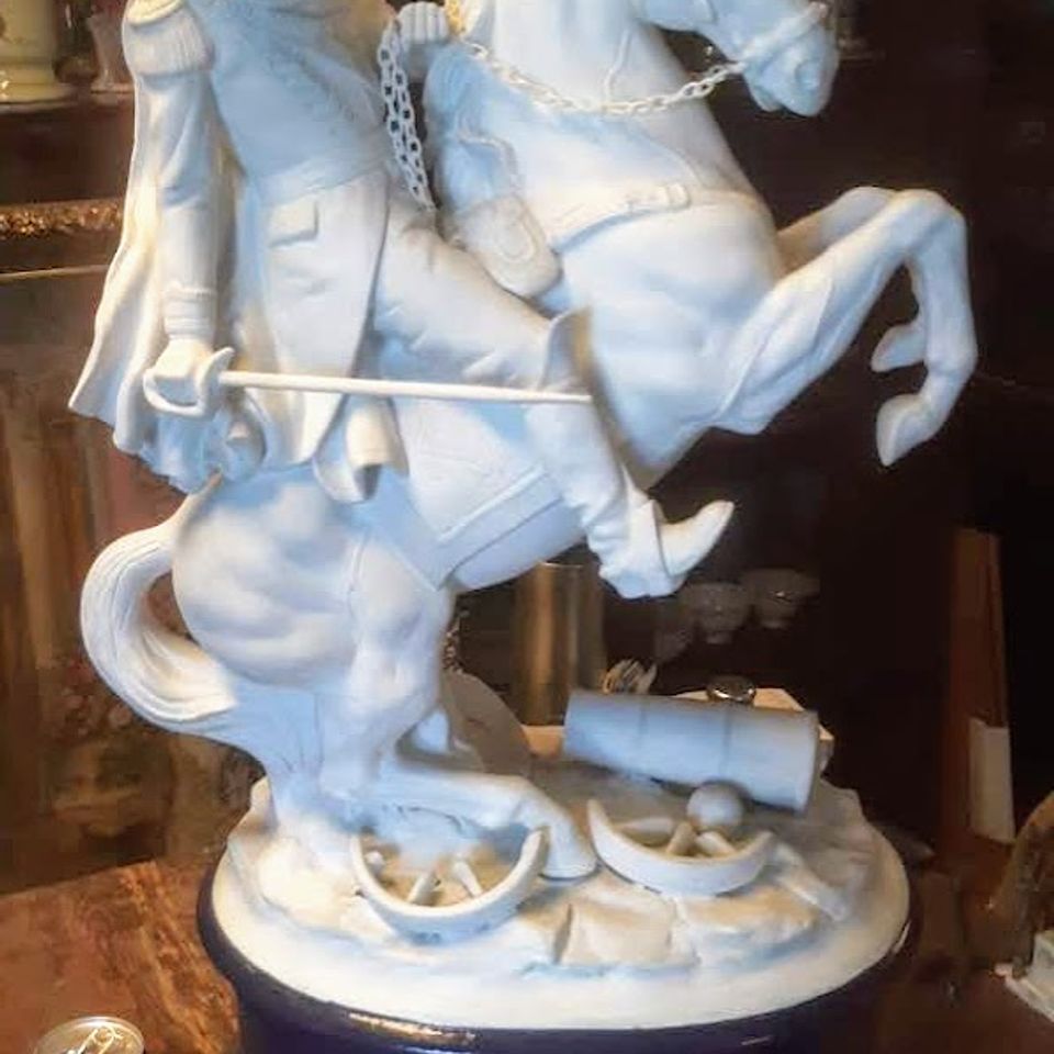 Porcelin man on horse