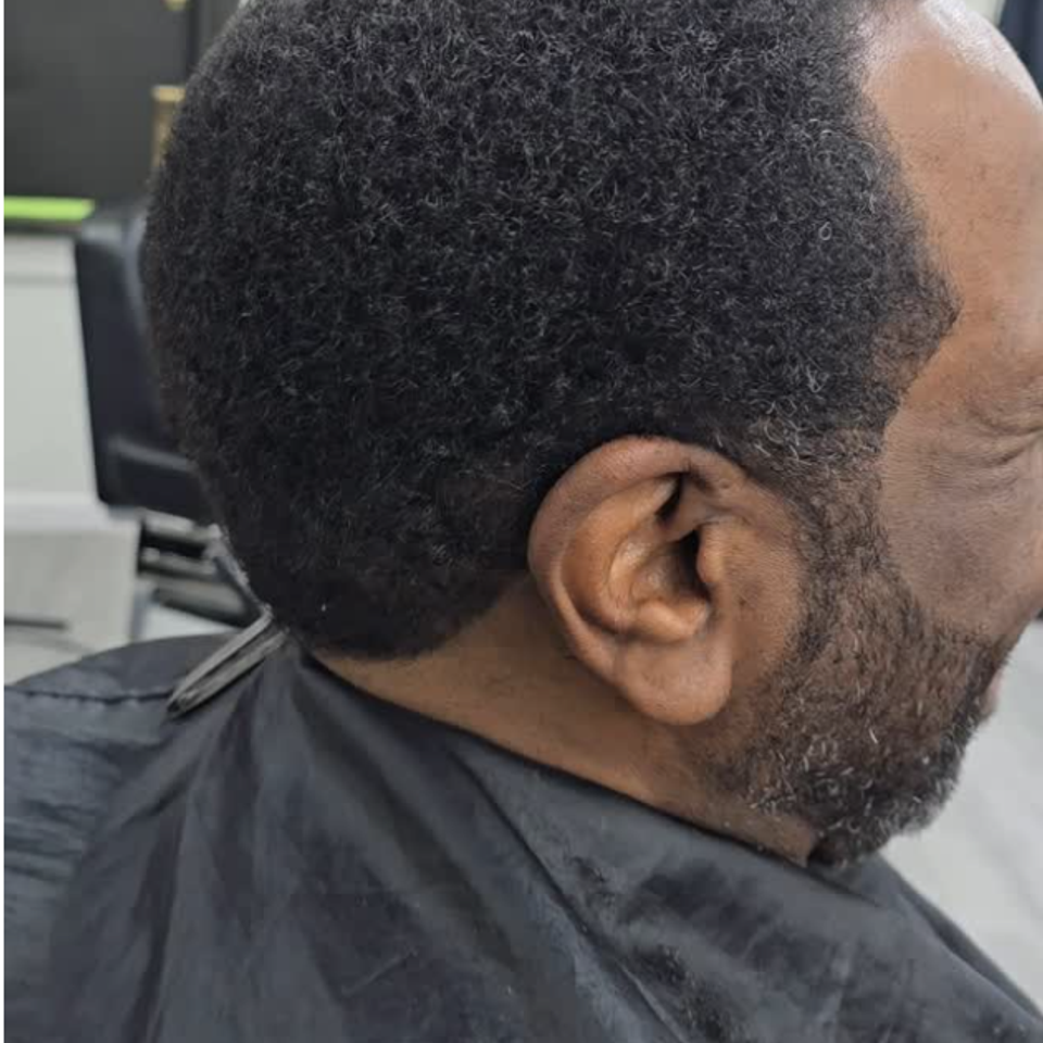 Back view of client’s natural hair before taper haircut at Bronx NY barbershop Jeff Barber Services
