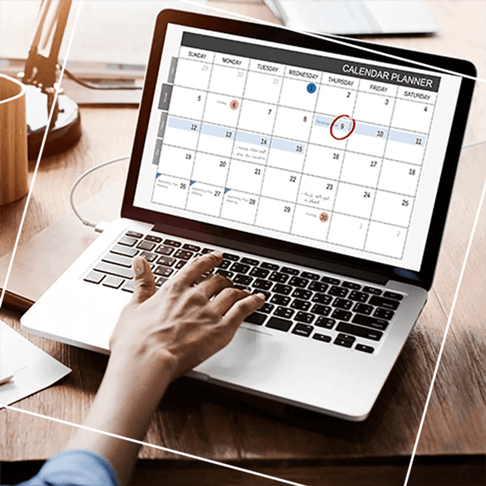 Person viewing calendar on laptop