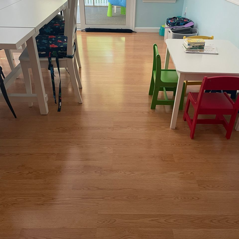 Clean kitchen with wood cabinets and tile floor after house cleaning service in Virginia Beach VA