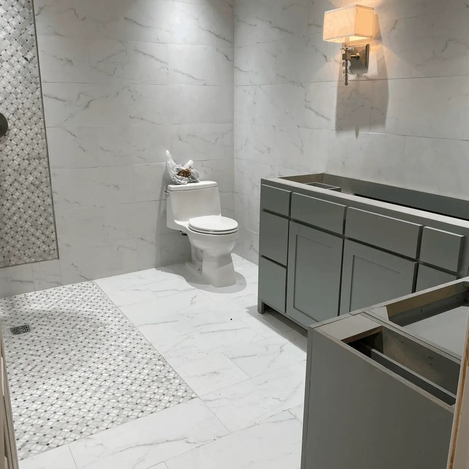 Bathroom remodeling project with tile shower and vanity installation by Media Construction