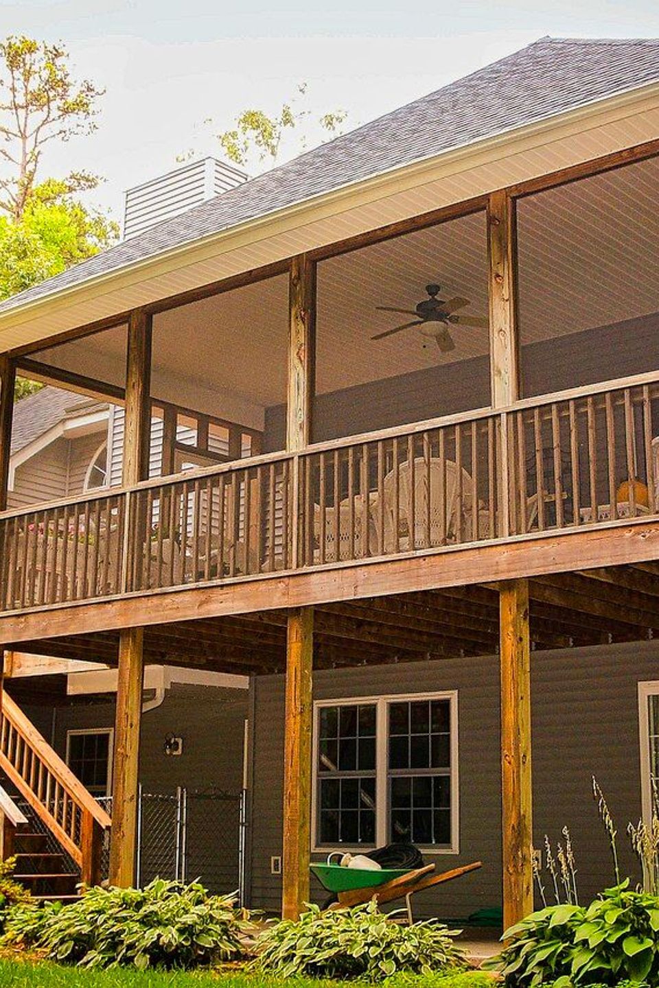 Nova Roofing + Construction LLC performing expert timber maintenance on a North Carolina log home, featuring meticulous log chinking, custom wood staining, and structural preservation in a rustic mountain setting.