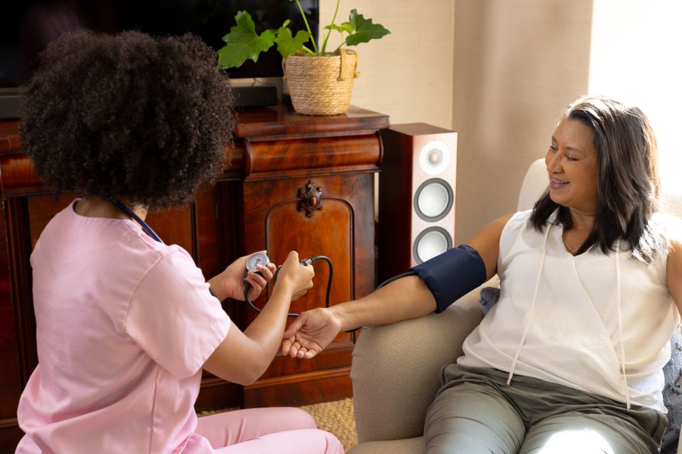 Biracial young woman checking blood pressure of ma 2024 04 22 21 13 33 utc (1)