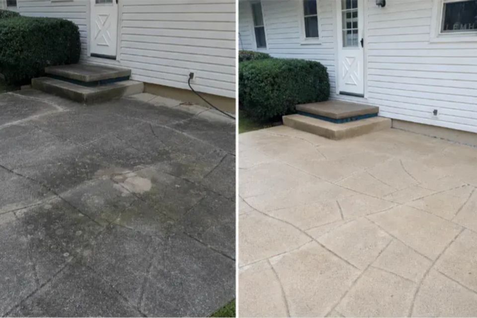 Before and after photos of a concrete patio after pressure washing.