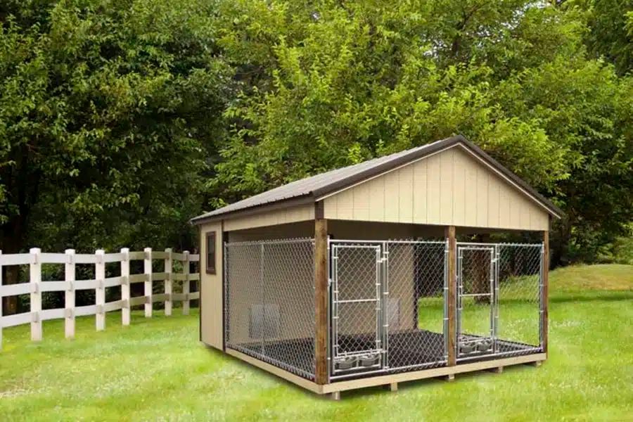Tan dog kennel with chain link runs and covered roof installed on a Knoxville TN property