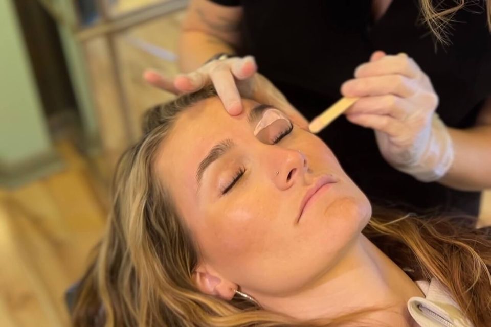 Facial waxing service including brows and upper lip