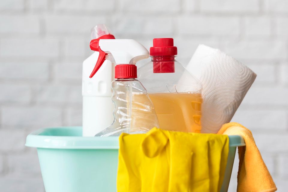 Front view bucket with cleaning solutions gloves