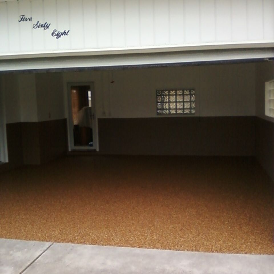 Residential garage featuring an EverStone decorative stone flooring system.