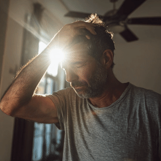 Mga4950 image description a frustrated homeowner adjusting th f9d1f54c 549a 4a61 a5b6 c7f165712e14 2
