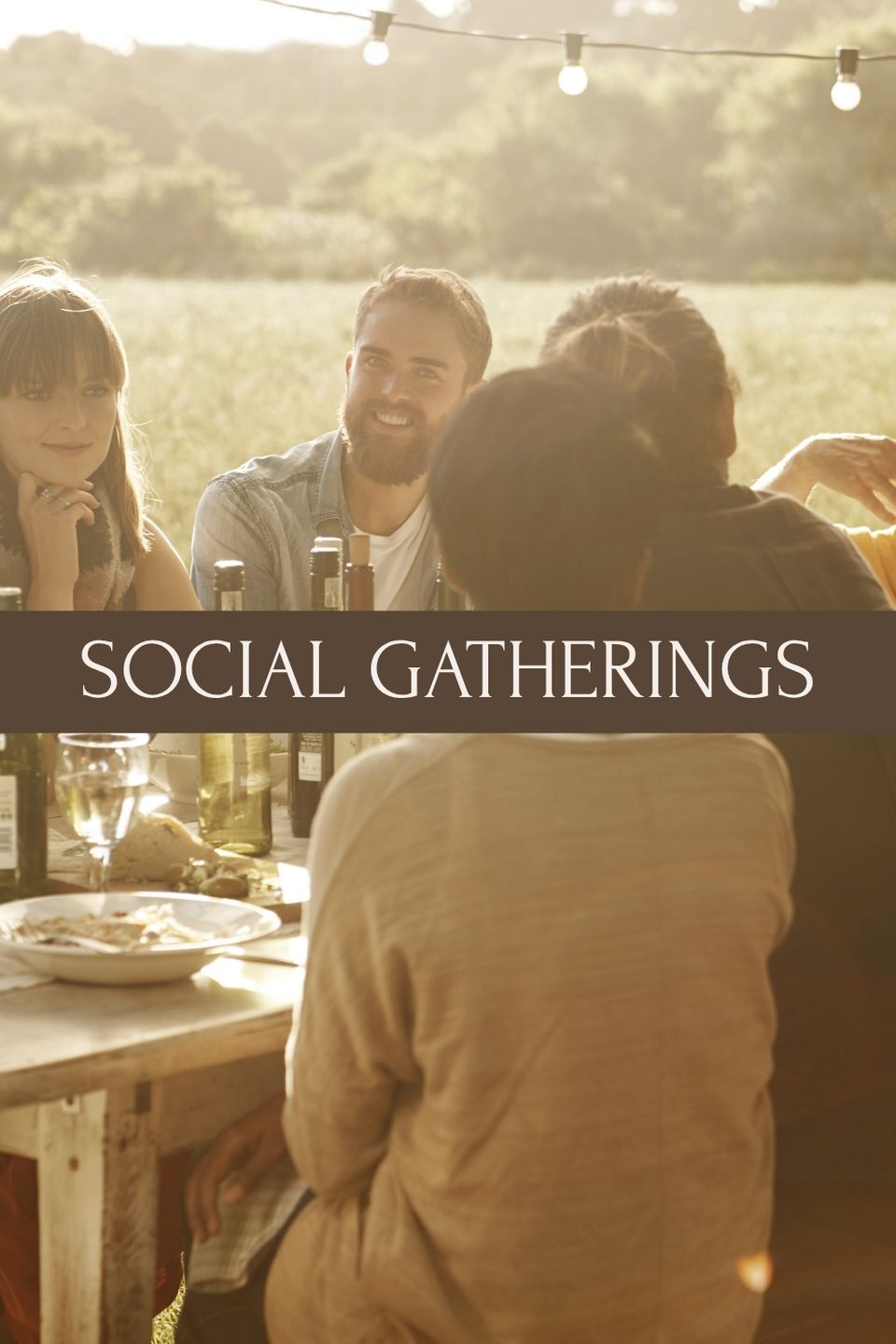 guests enjoying outdoor social gathering at rustic farm event venue with scenic countryside views