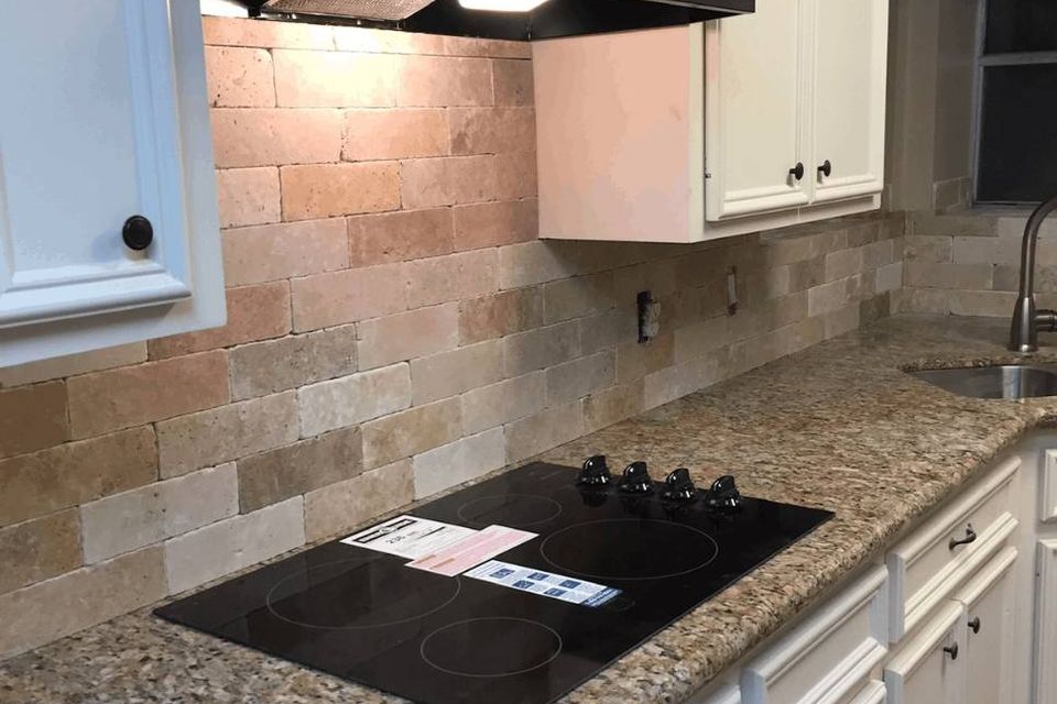 Finished kitchen remodel with granite countertops, tile backsplash, and updated cabinetry in Spring TX