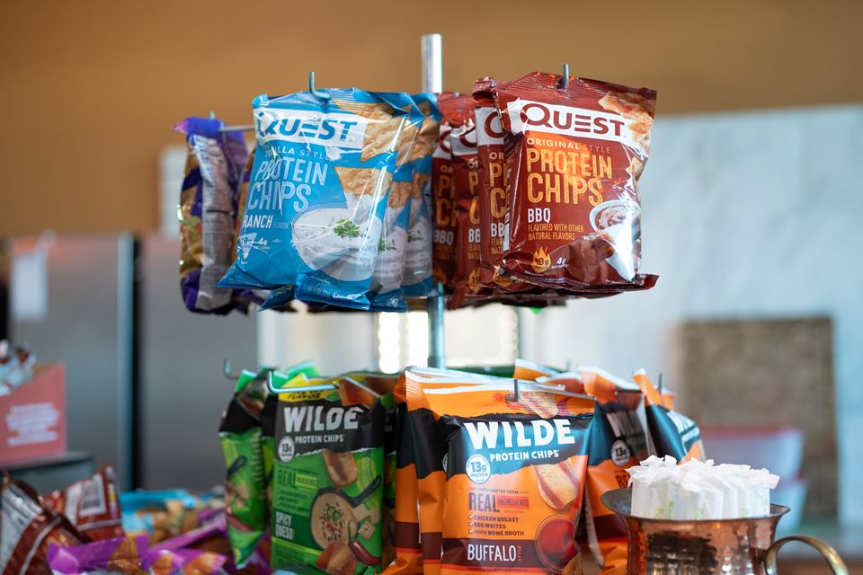 A variety of protein snacks on display behind the smoothie bar at Maximus Gym in Riverhead