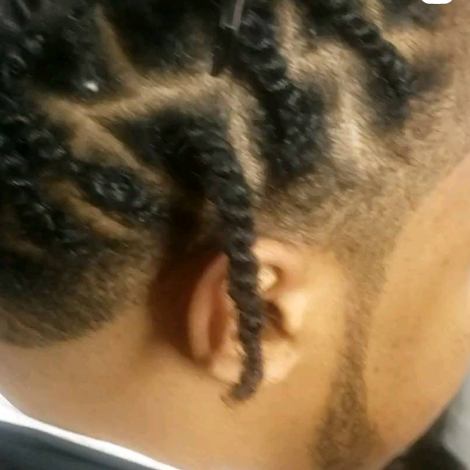 Men’s braids with taper fade in Kingsbridge Bronx at professional barbershop