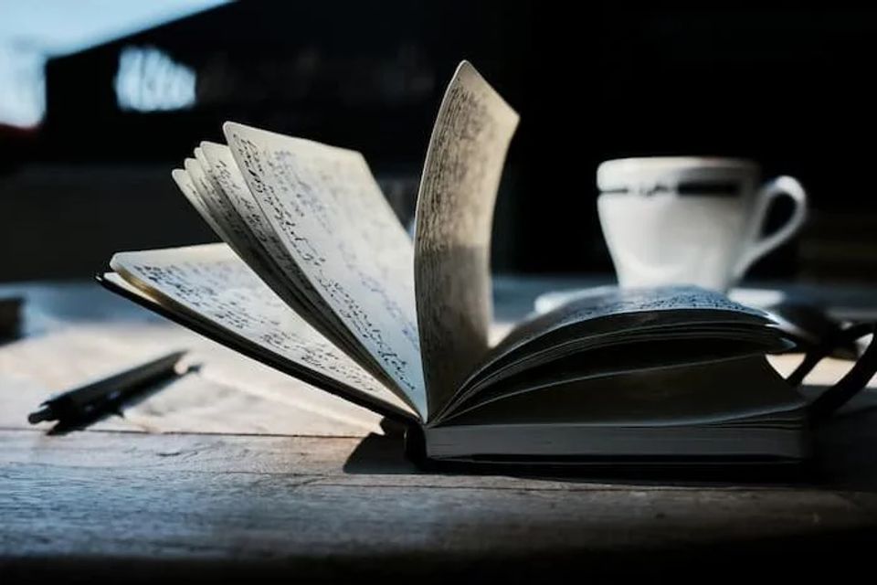 Journal with the pages flapping open 