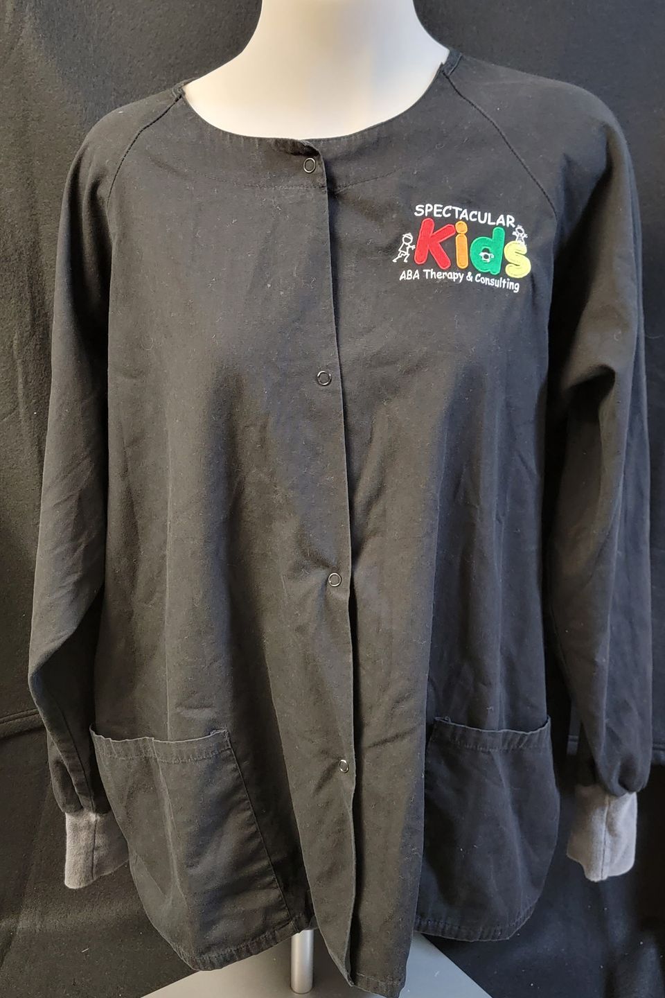 Embroidered logo on gray smock 