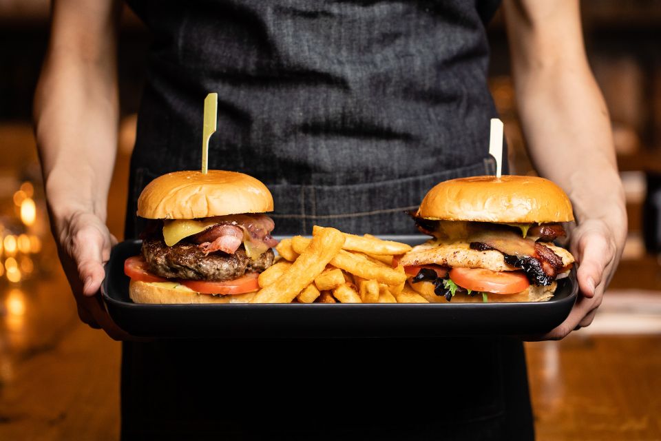 serving cheeseburgers