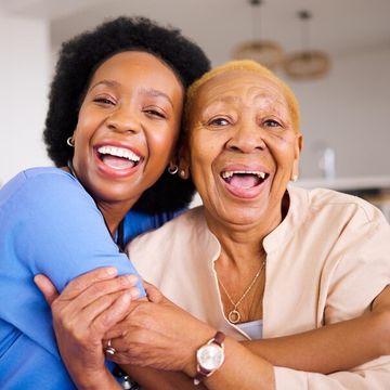Black people nurse patient hug elderly care love support trust together sofa home portrait happy african medical caregiver enjoying time with senior fema