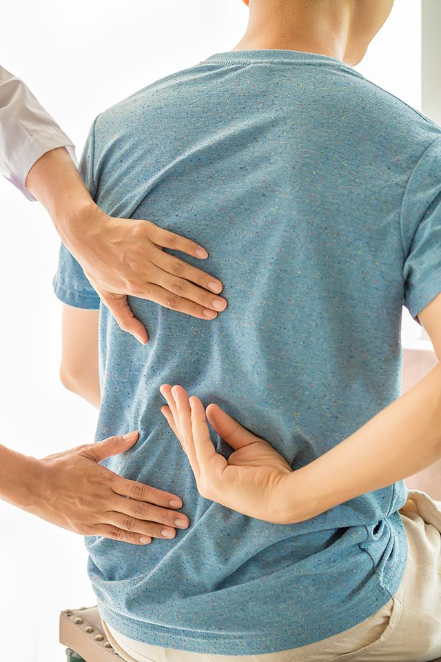 Close up physiotherapist working with patient clinic