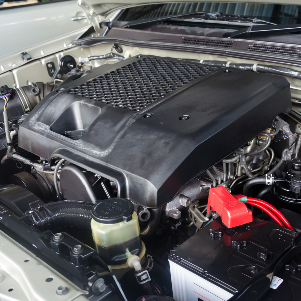 Close-up of a vehicle engine during routine maintenance and inspection.
