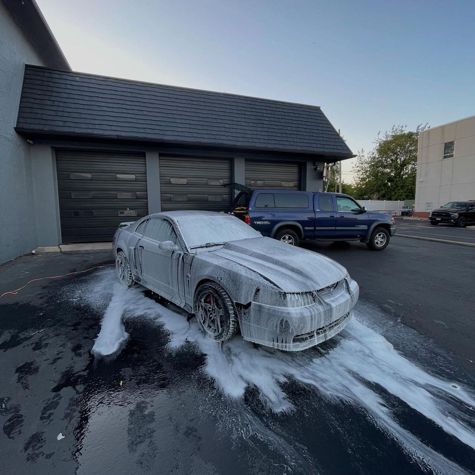 Ford Mustang GT covered in thick foam pre-wash during a mobile exterior cleaning in Wilmington DE