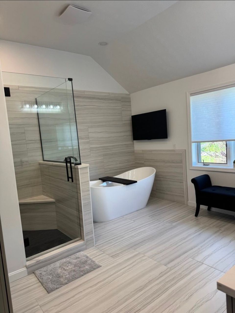 Primary bathroom remodel with freestanding soaking tub and walk-in glass shower in a Cleveland east side home