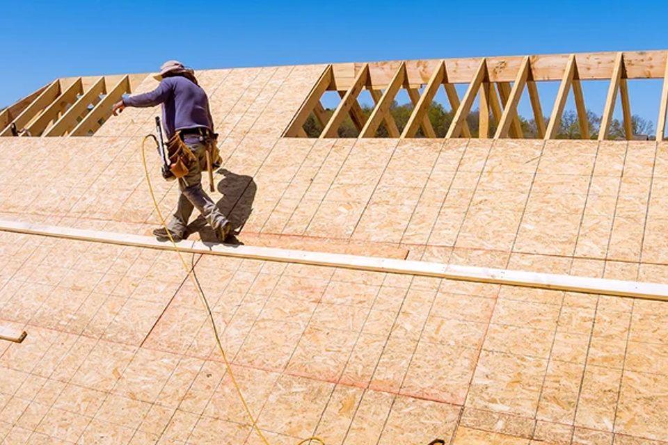 Licensed NC contractor installing new plywood roof sheathing on a residential home in Carolina Beach 28428