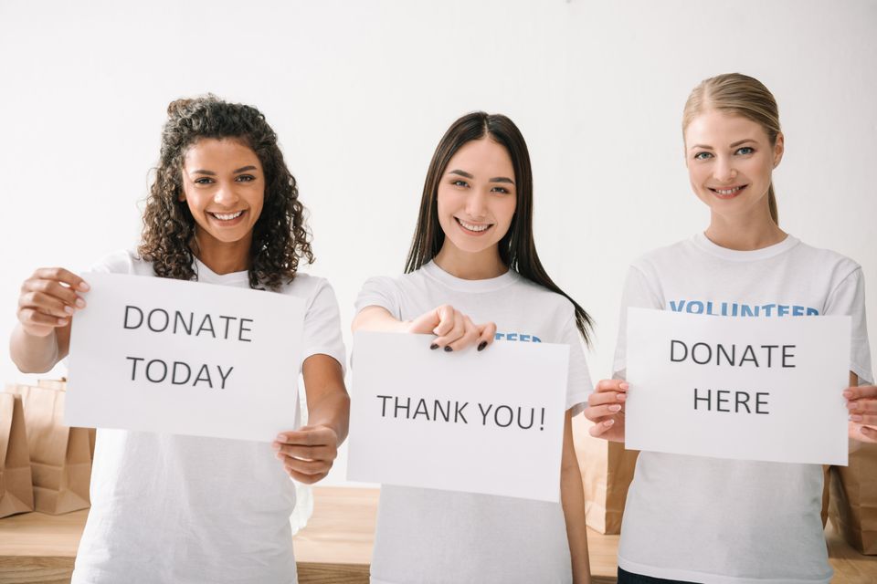 Happy multiethnic female volunteers holding charit 2024 11 19 13 07 50 utc