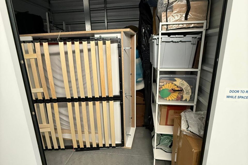 A packed out storage container with junk