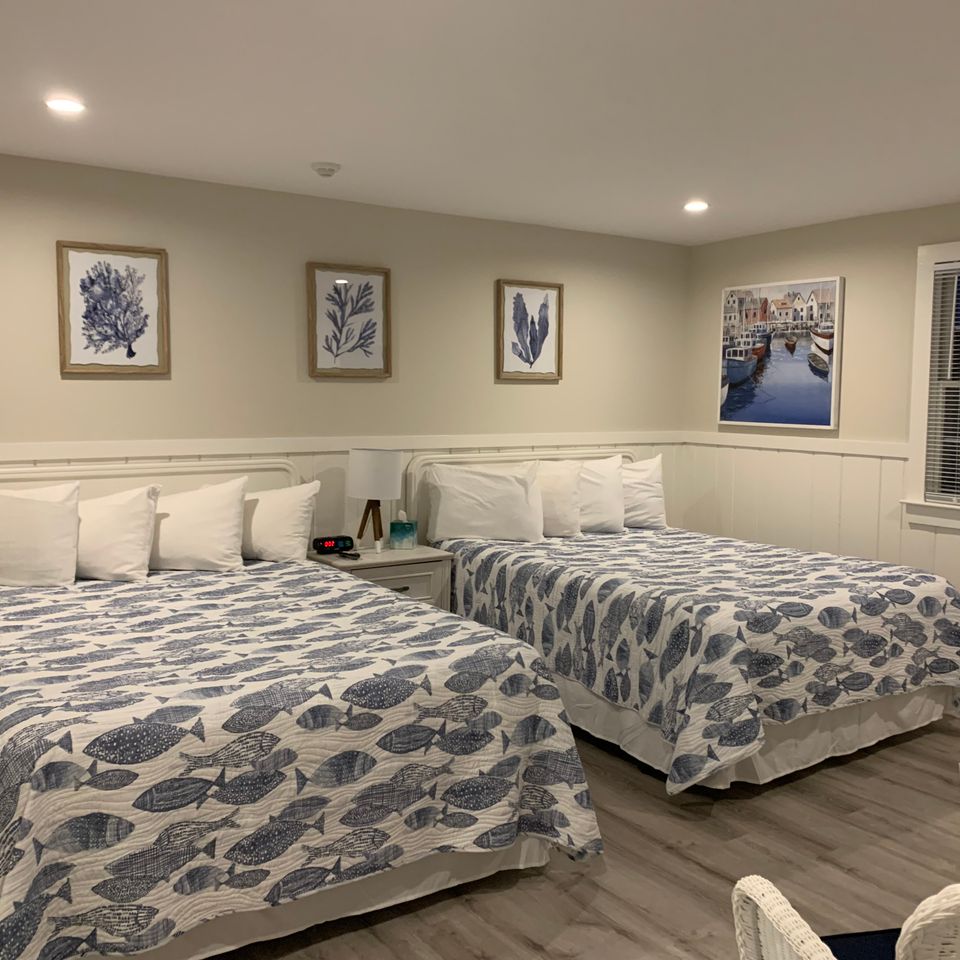 Brewster room with two queen beds patio access and renovated bathroom