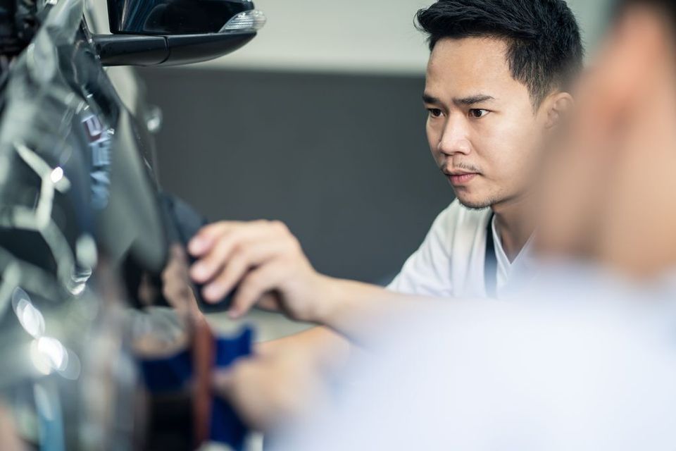 Asian car film protection male worker installing f 2021 10 27 19 53 08 utc (1)