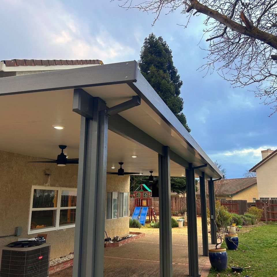 Custom attached covered patio with ceiling fans and recessed lighting in Elk Grove CA