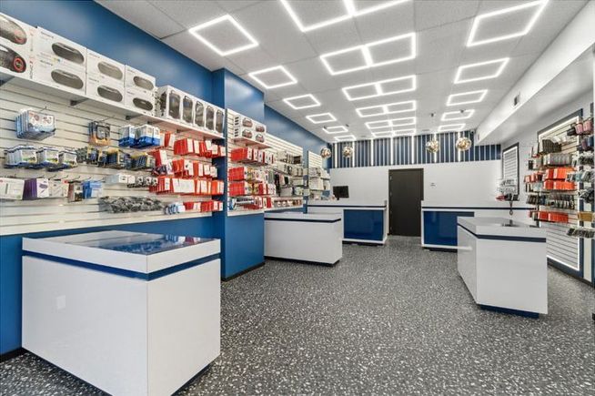 Ultimate Kitchens’ custom shelving and displays for a technology store interior.