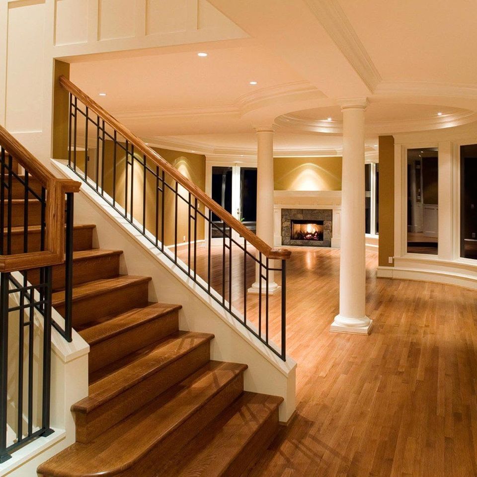Grand staircase columns and hardwood floor