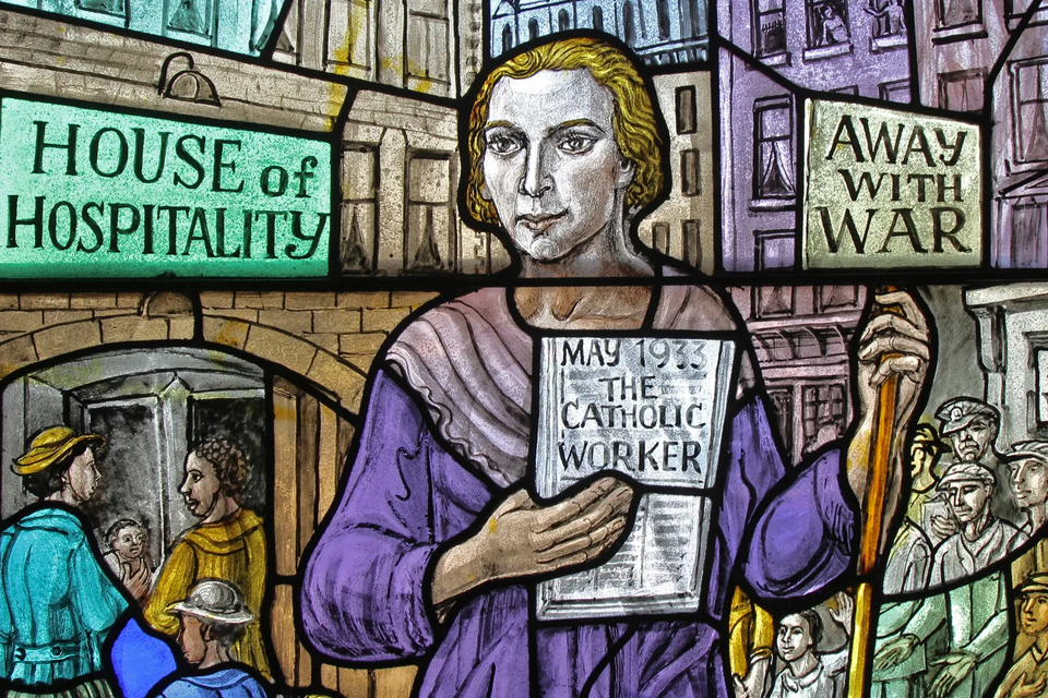 “Stained-glass artwork depicting the Catholic Worker Movement with themes of hospitality, peace, and service.”