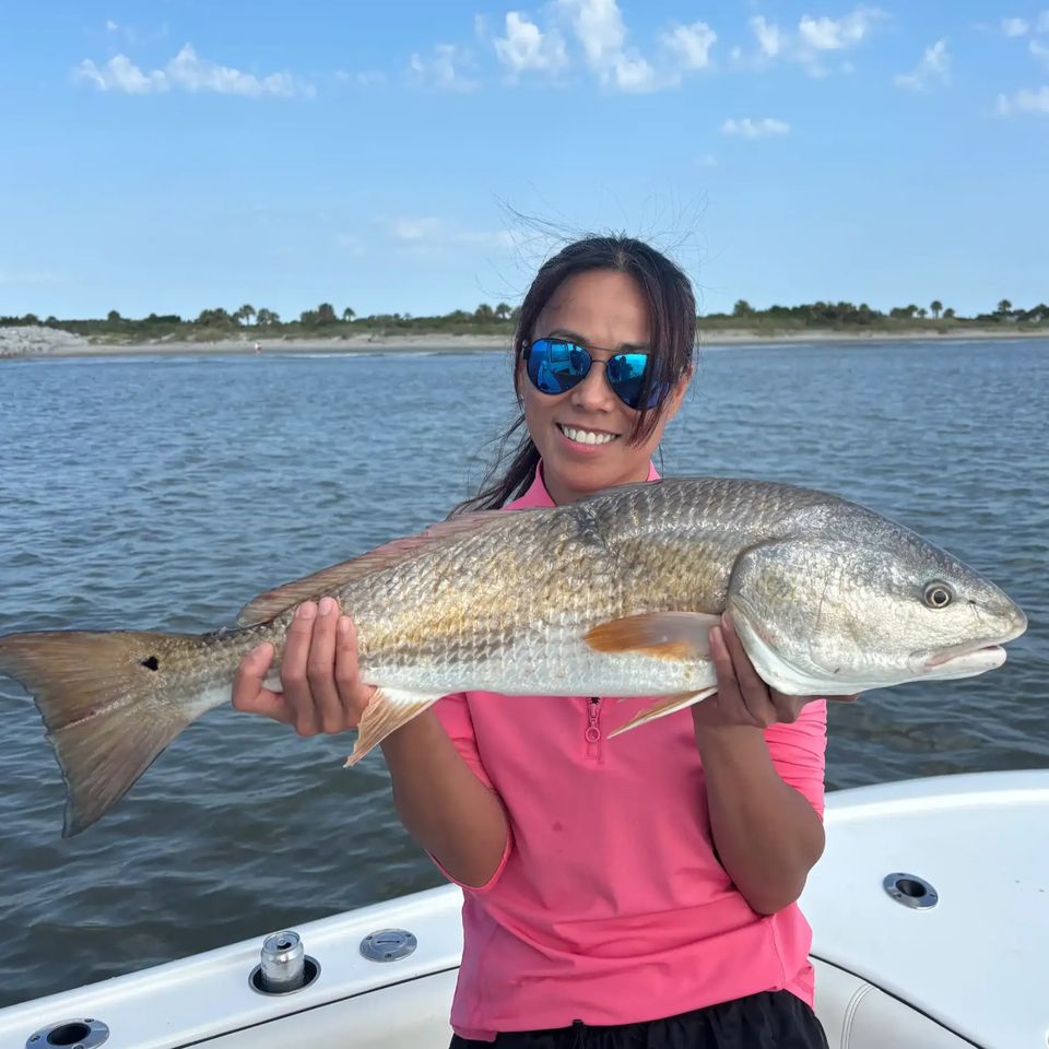 woman-holding-red-drum-fish-charleston-sc-inshore-fishing.jpg