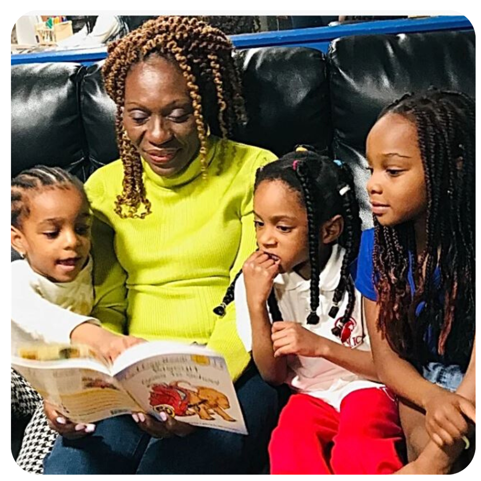 Esther reading on couch with children in frame