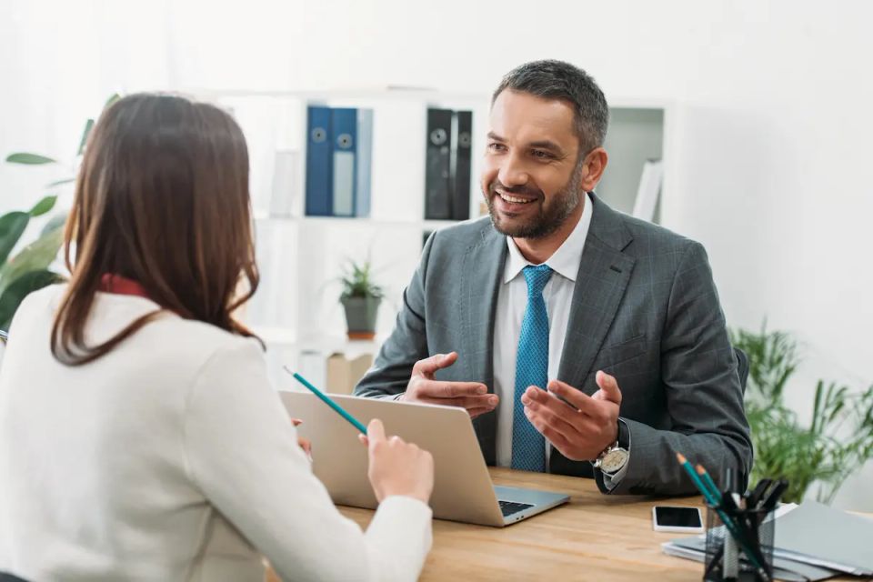 Vistacreate 247757430 stock photo selective focus advisor sitting table laptop woman office