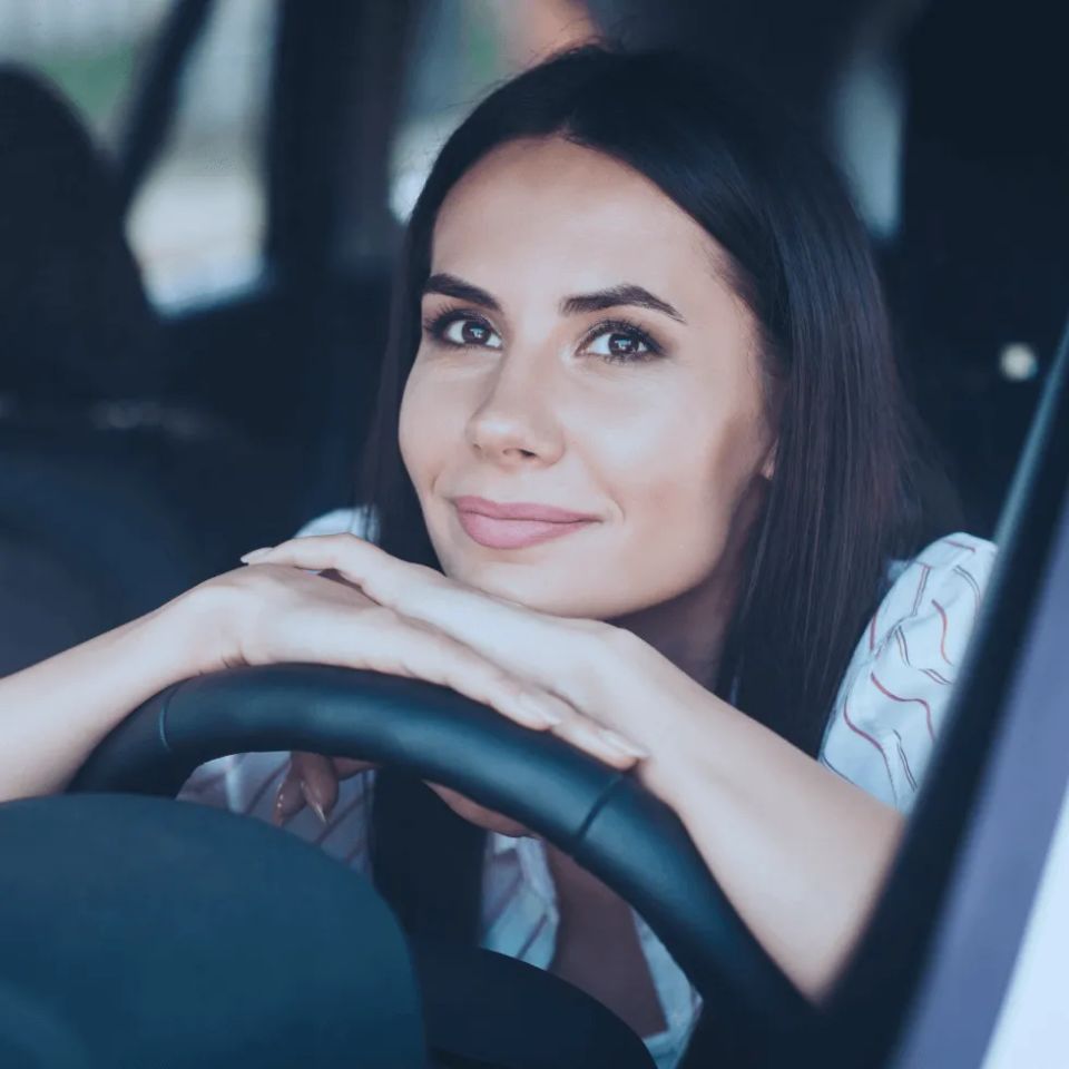 Woman in car driver seat