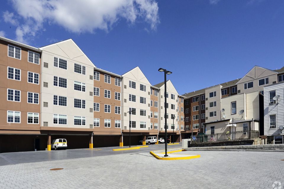 Professional multi-family residential building featuring custom kitchen cabinetry by Ultimate Kitchens.