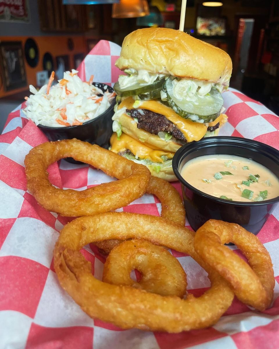 Coleslaw, burger and onion rings from Inferno The Restaurant in Sound Beach