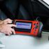 Bedford auto repair hands mechanic using diagnostic tool