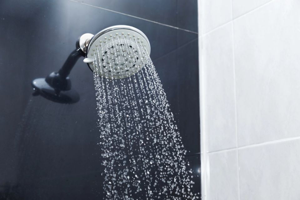 A shower head with the water turned on