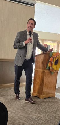 Frank larose at podium