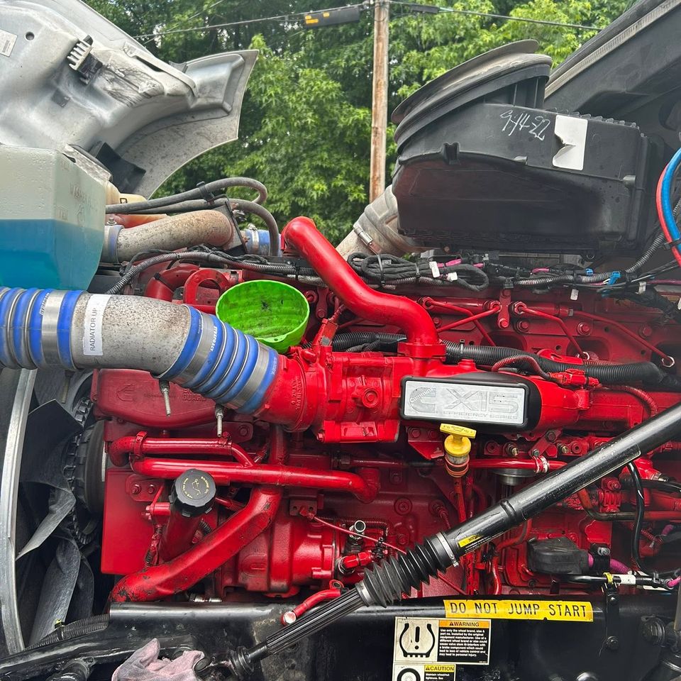 Cummins X15 diesel engine bay during fluid service on semi-truck in Arab Alabama