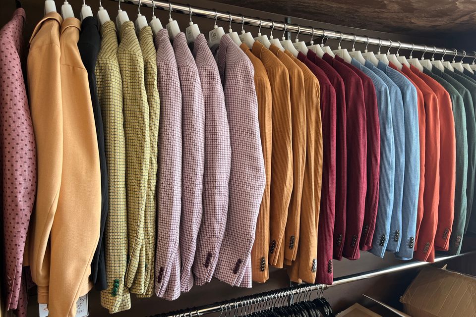 T   v sports coats on a rack
