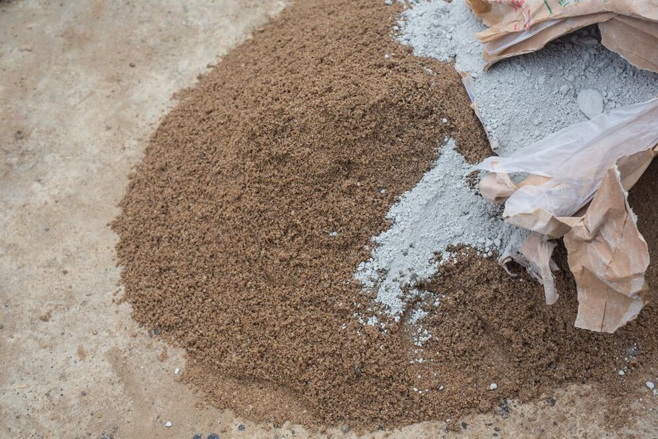 Construction technicians are mixing cement stone sand construction 1150 14774