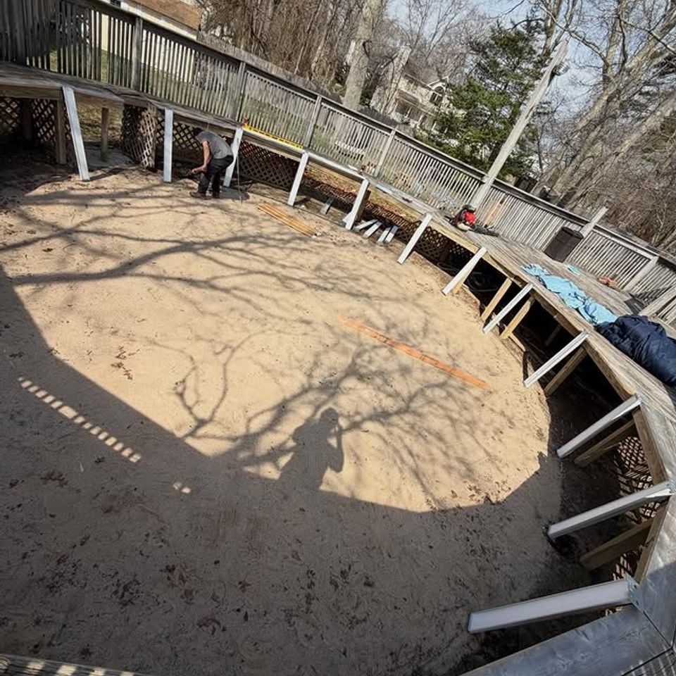 Above ground pool base leveled beside a wood deck at a Long Island NY home