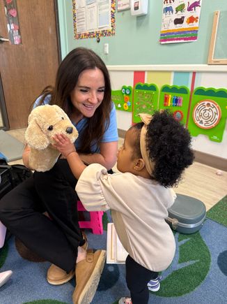 Claire with a puppet.
