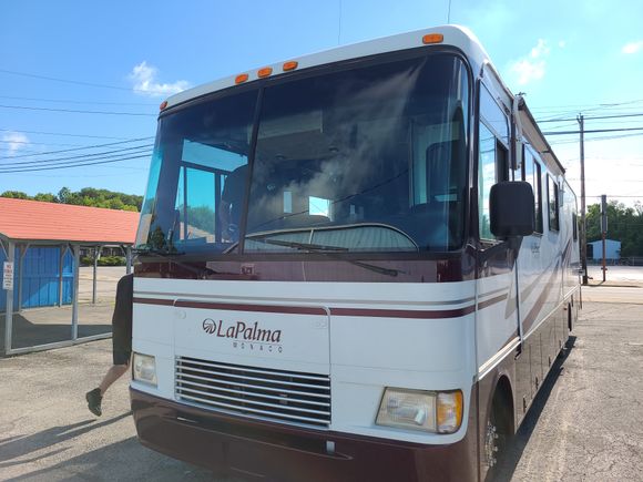 Motorhome with a newly installed windshield after professional replacement.